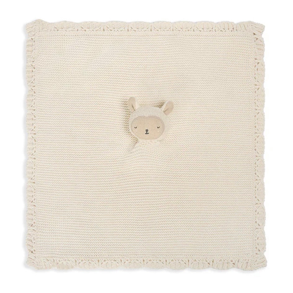 Knitted blanket with a sheep applique on a white background
Made from organic cotton