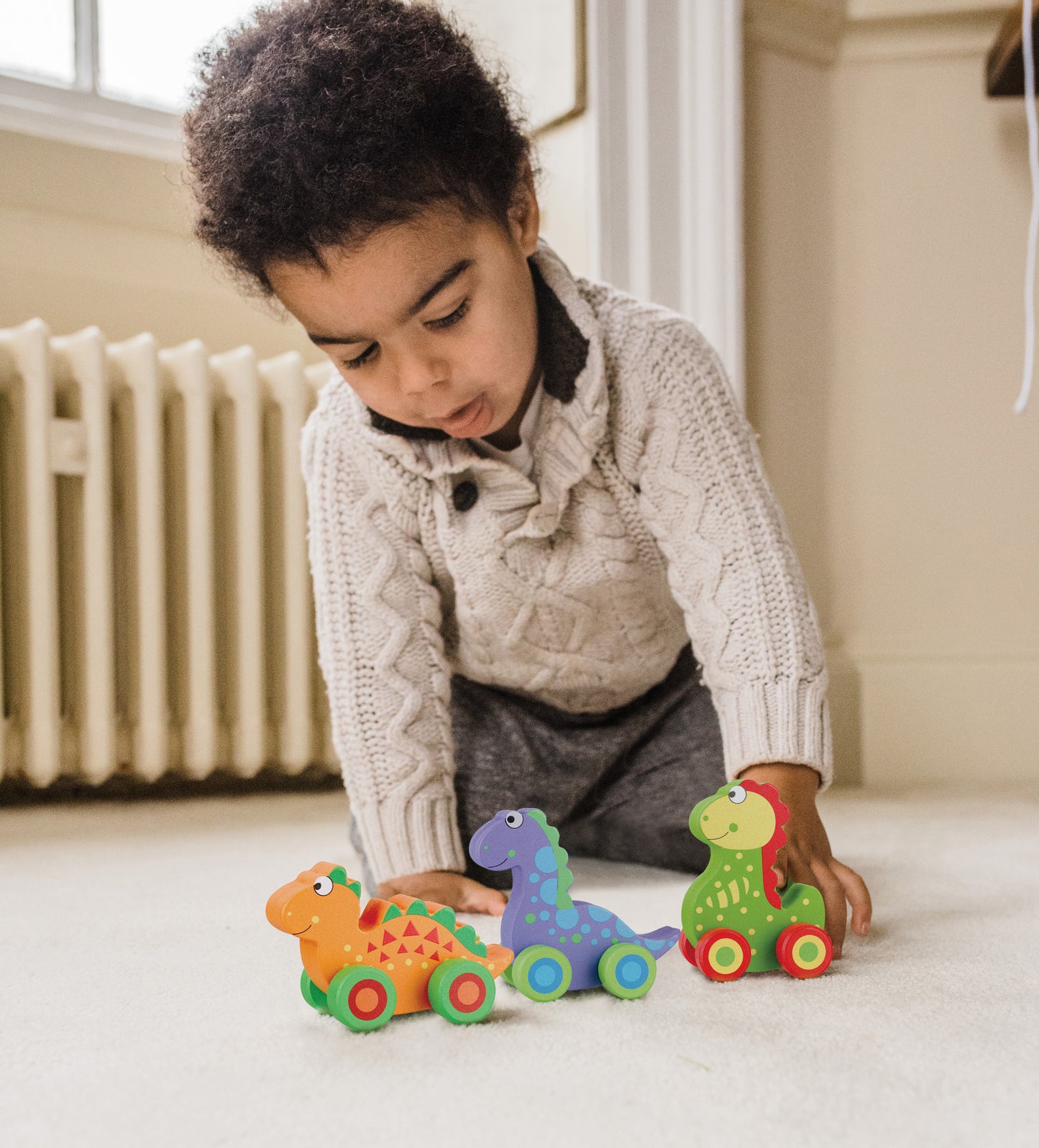 Child playing with our wooden Dinosaur Push Toys - Set of Three
Perfect for toddlers