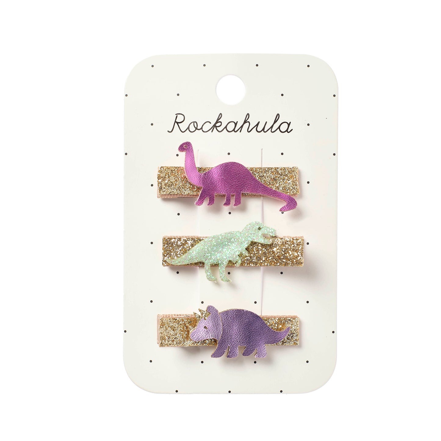 Three dinosaur hair clips on a Rockahula branded card.