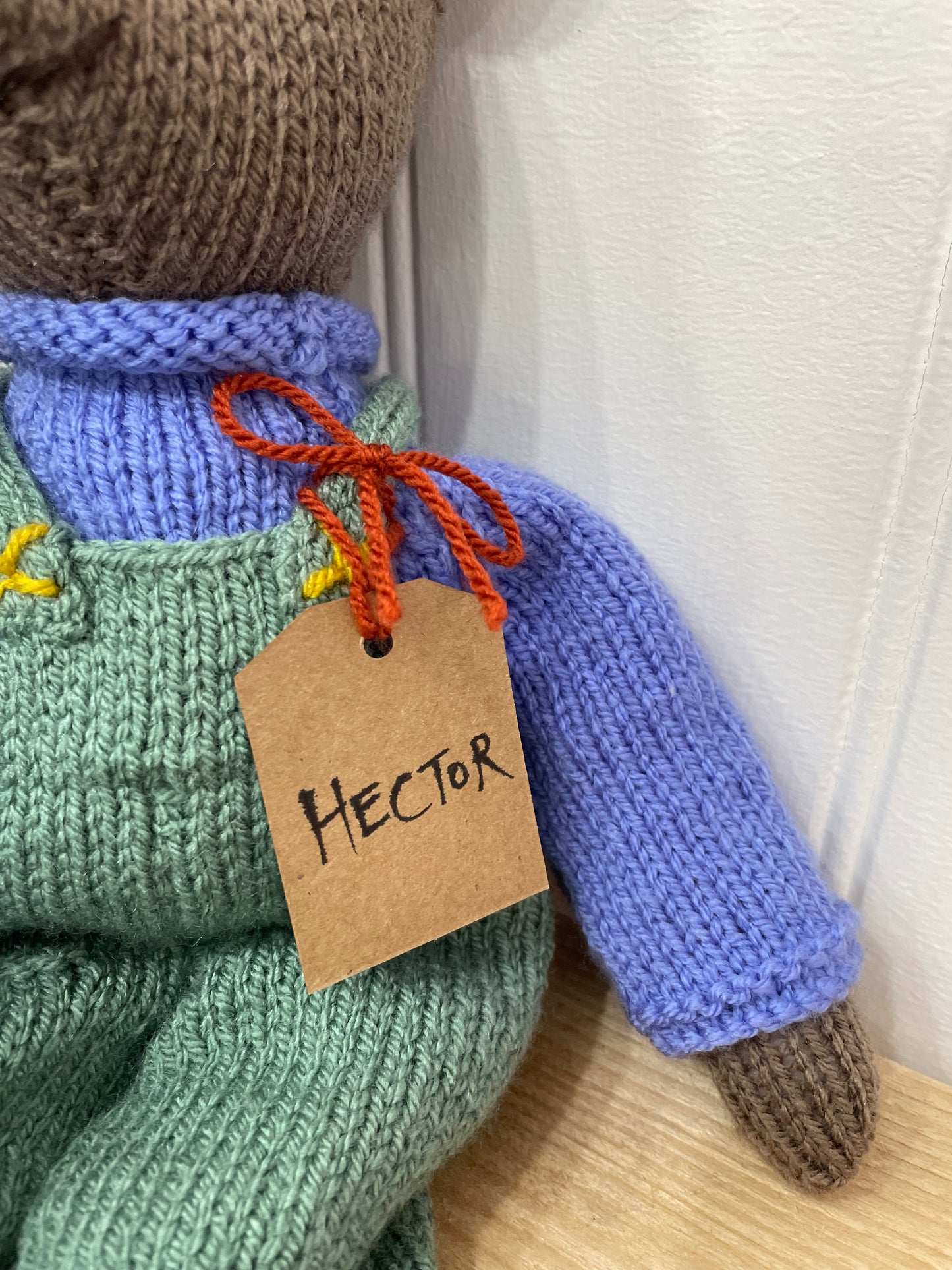 Tag showing the name Hector on one of our hand knitted bears