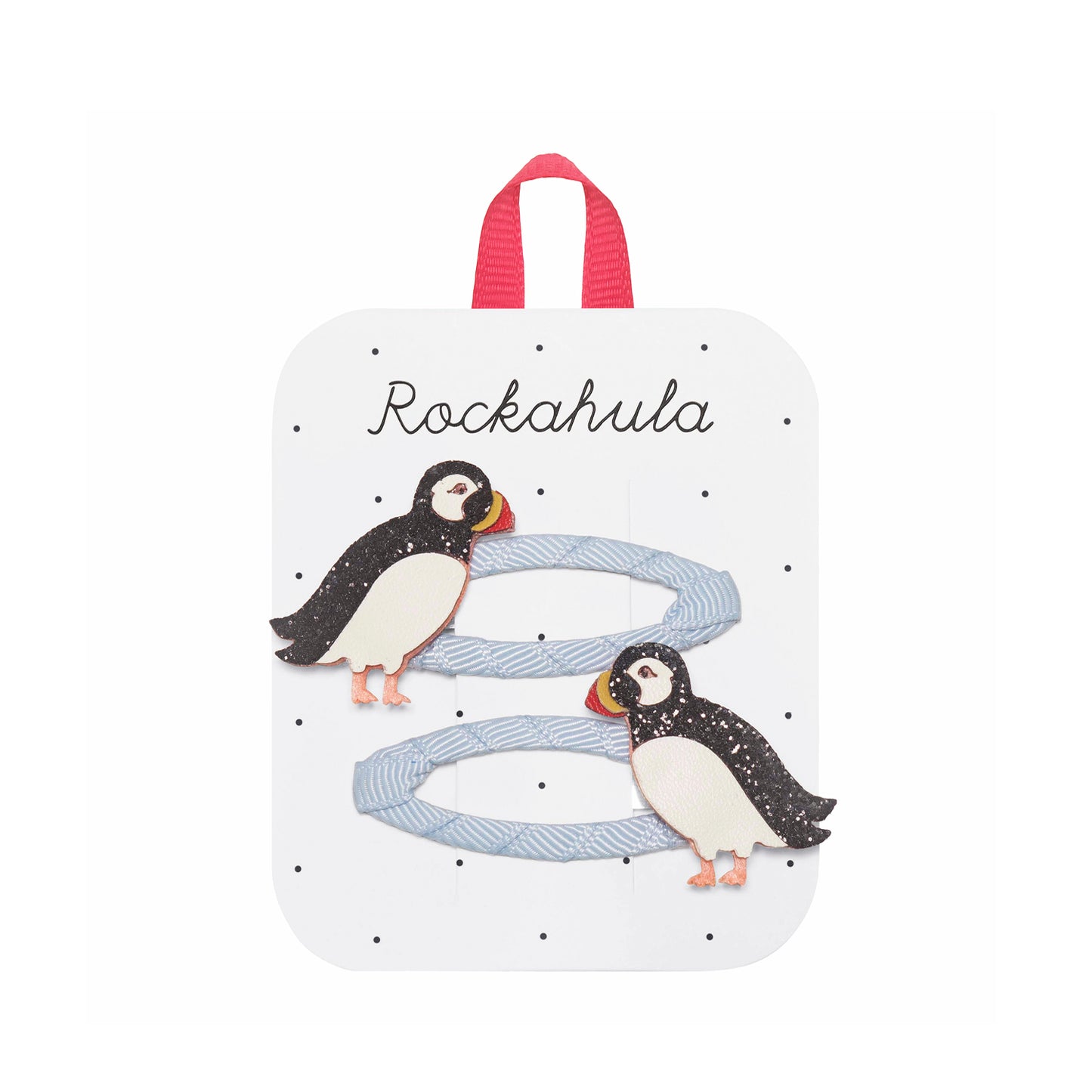 Set of two puffin themed hair clips on a packaged 'Rockahula' card