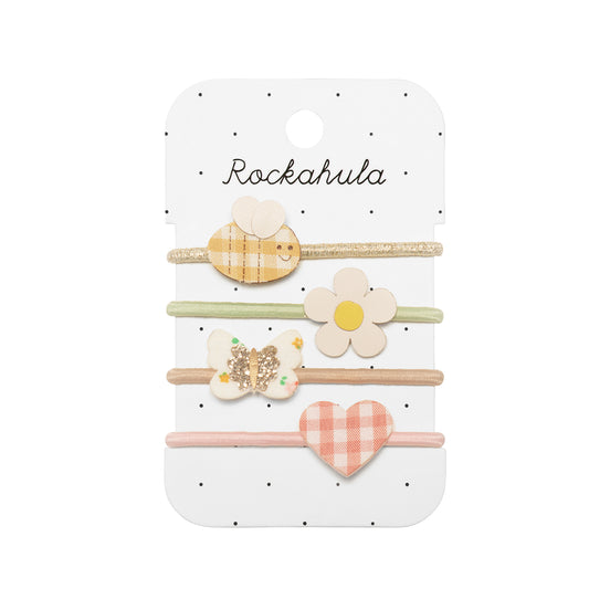 Set of hairbands with decorative clips on a Rockahula branded card.