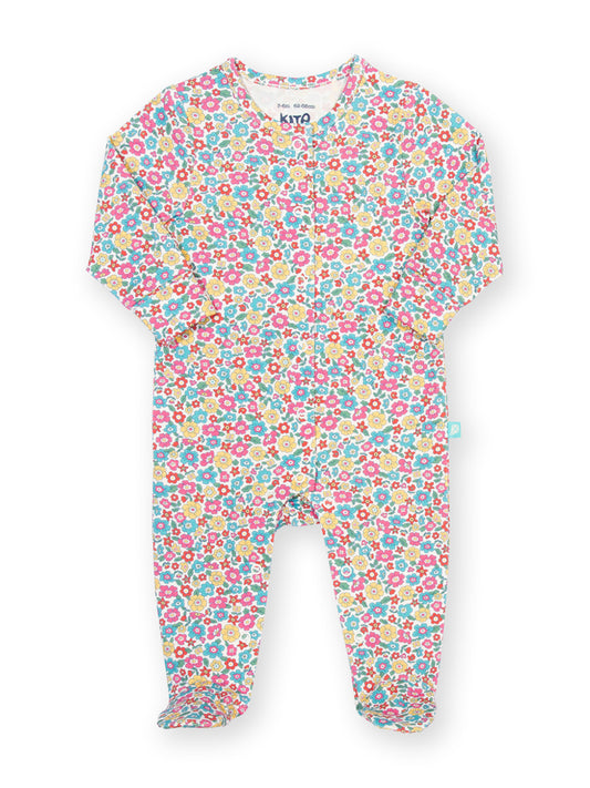 Floral patterned baby onesie on a white background