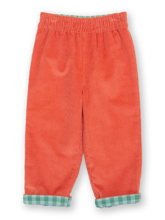 Orange corduroy pants with green plaid cuffs on a white background