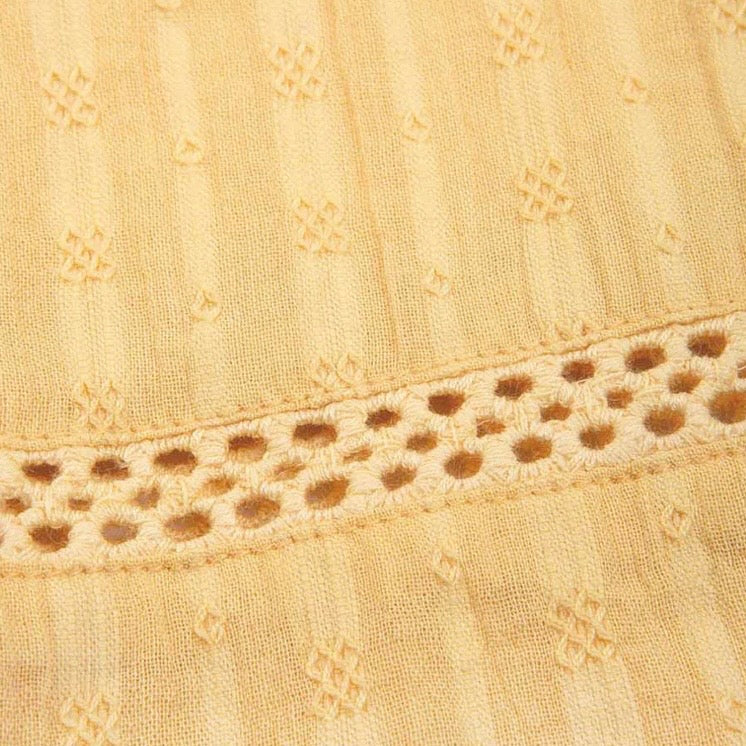 Close-up of yellow fabric with intricate lace trim

Children's clothing 
Yellow
Blouse
Organic cotton 
Summer clothing 
Summer