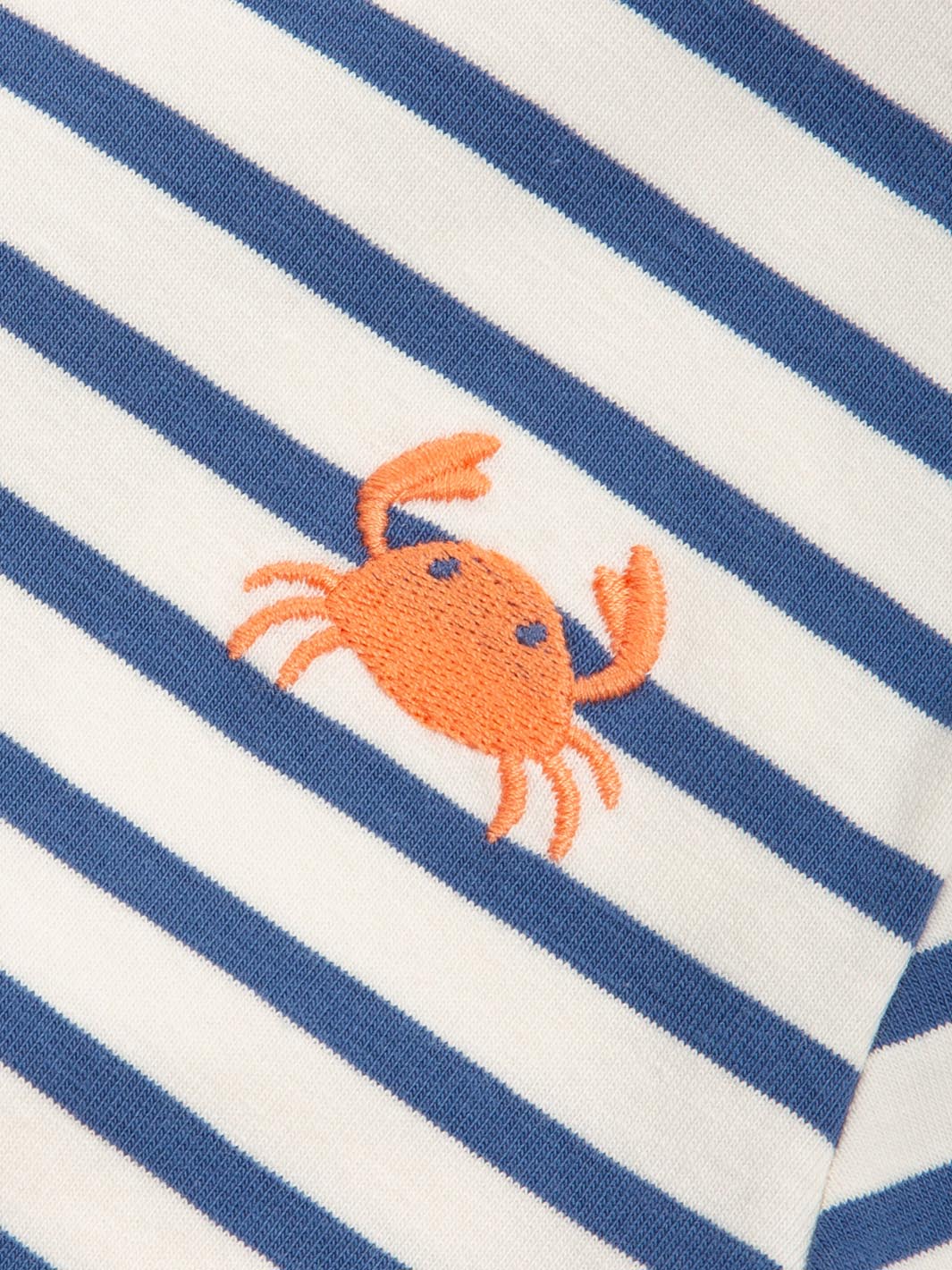 Striped t-shirt close up  with an embroidered orange crab on a blue and white background

Children's clothing 
Crab 
Stripes 
T-Shirts
Organic cotton 