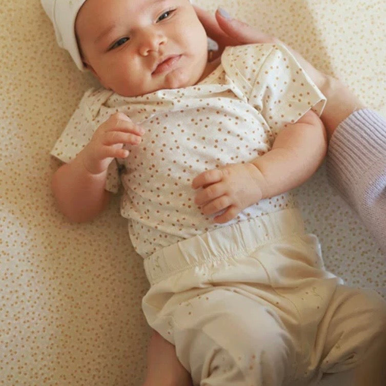 Baby wearing our Daisy Meadow Bodysuit
Made from organic cotton