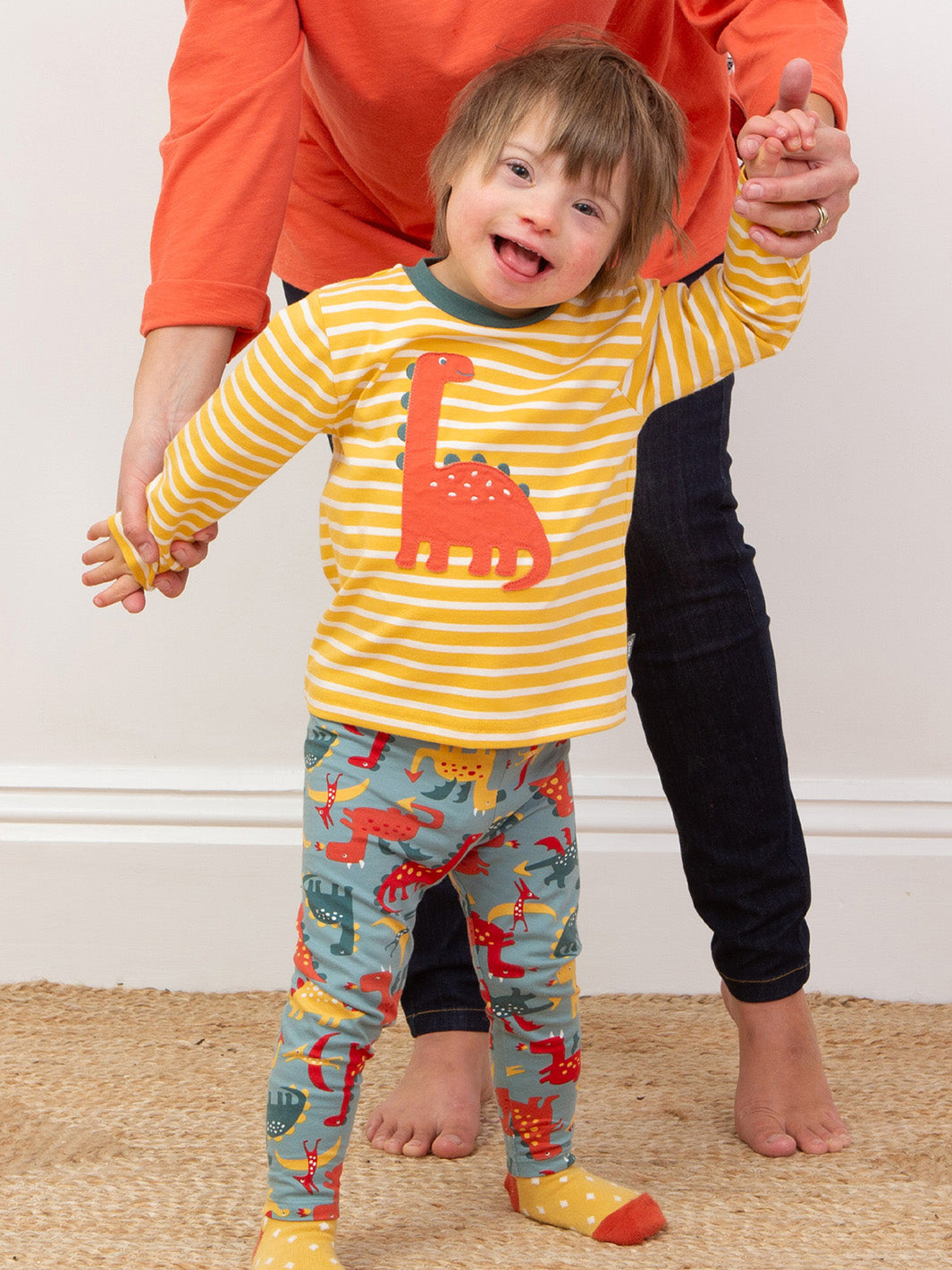 Child wearing our Dino's & Dragons Leggings matched with our Dinky Dino T-Shirt
