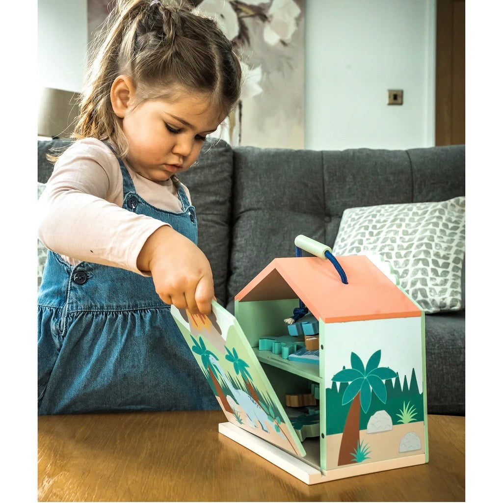 Child packing away our Dinosaur Play Set