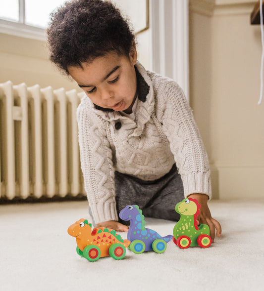 Child playing with our wooden Dinosaur Push Toys - Set of Three

Perfect for toddlers 