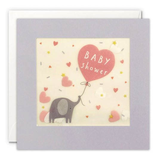 Baby shower card with an elephant holding a heart-shaped balloon on a light purple background