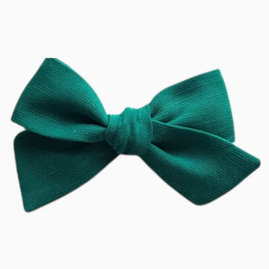 A classic pre-tied bow tie in a rich emerald green color, displayed against a clean white background.

Hair Clips
Liberty Print
Gift inspiration 
Floral
Girls Hair Accessories