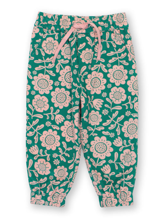 Floral-patterned cord trousers  on a white background