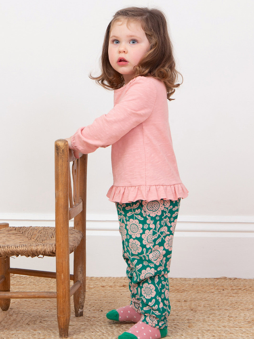 Girl modelings our folksy cosy cords and pink tunic 
