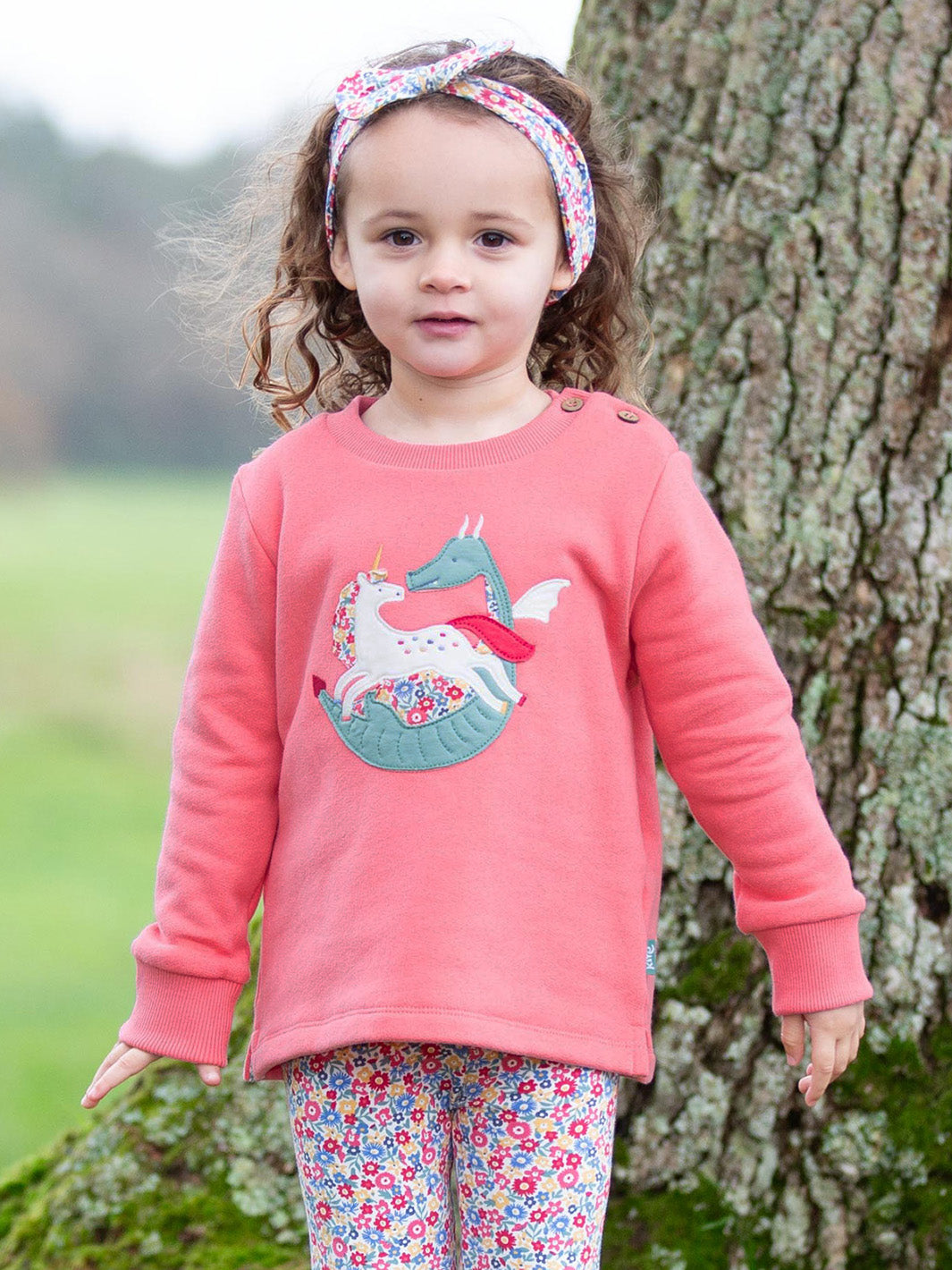 Child wearing our Folktale Sweatshirt with matching Ditsy floral leggings 
Made from organic cotton 