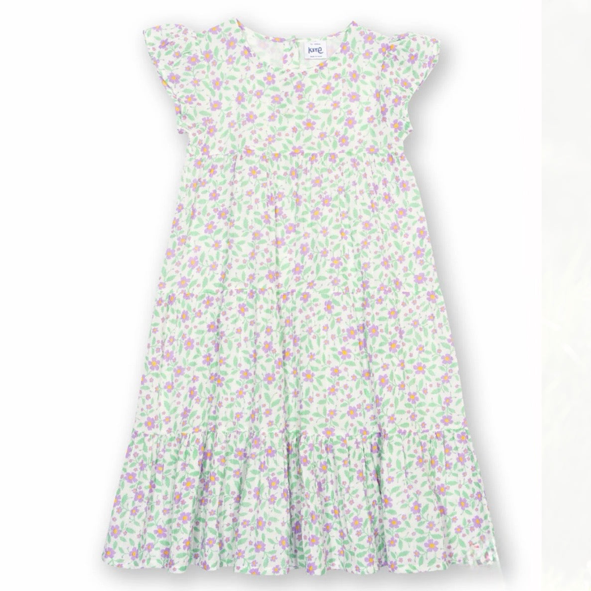 A sleeveless tiered dress with a white base and a delicate green and pink floral print, featuring ruffled cap sleeves and a smocked bodice.

Children's clothing 
Dress
Kids clothes
Floral dress
Occasion dress
GOTS Certified fabrics 
Kite clothing 