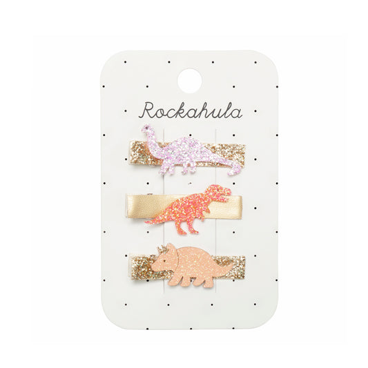 Set of three dinosaur-themed hair clips on a Rockahula branded card.