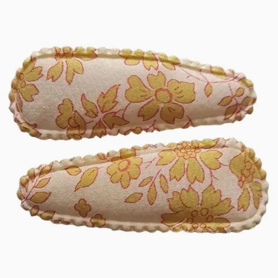 Two fabric-covered rectangular slippers with a yellow floral pattern on a cream background, shown against a plain white background.

Hair Clips
Liberty Print
Gift inspiration 
Floral
Girls Hair Accessories