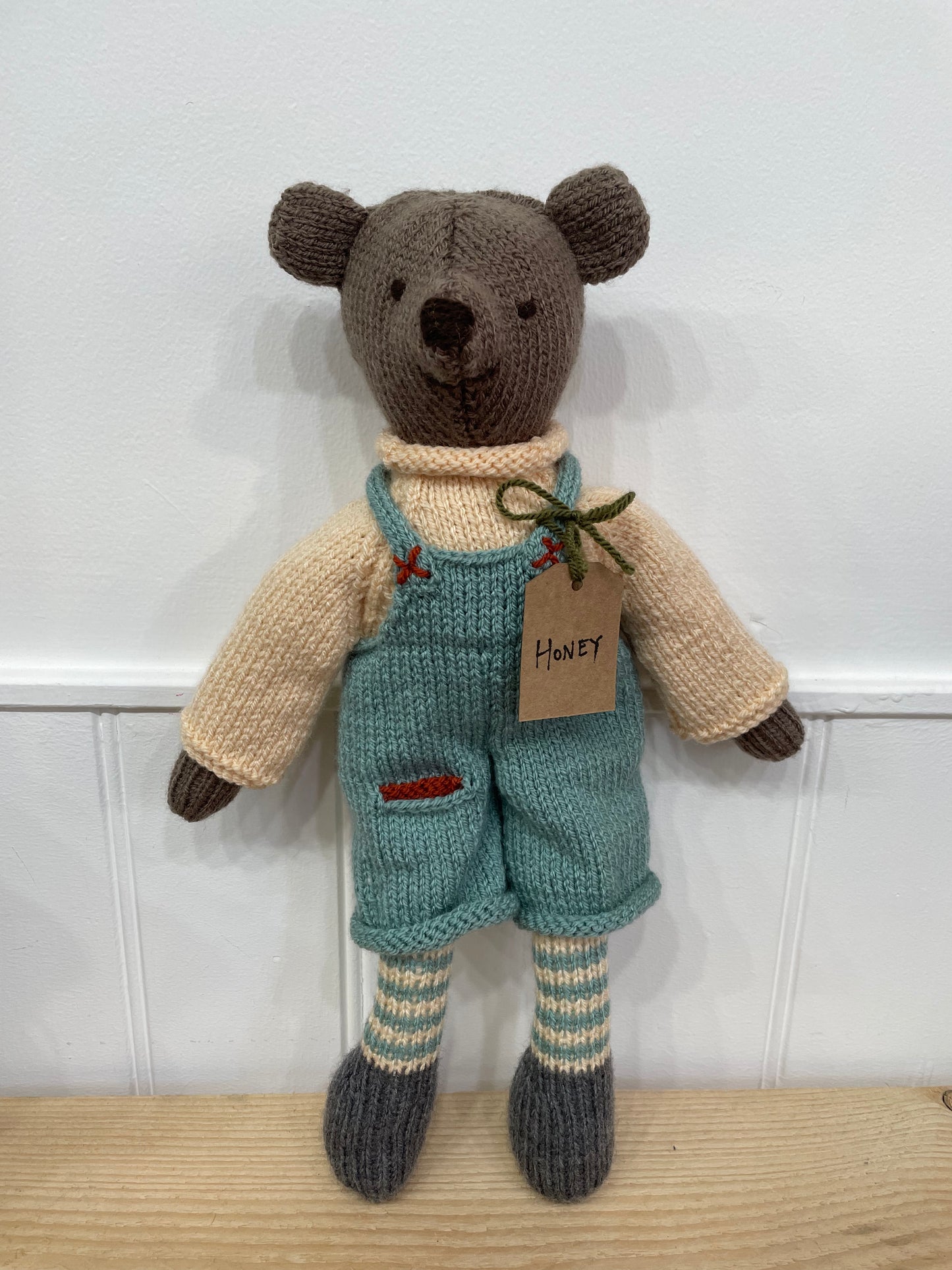 Hand knitted soft toy bear. 
Made in South Oxfordshire 