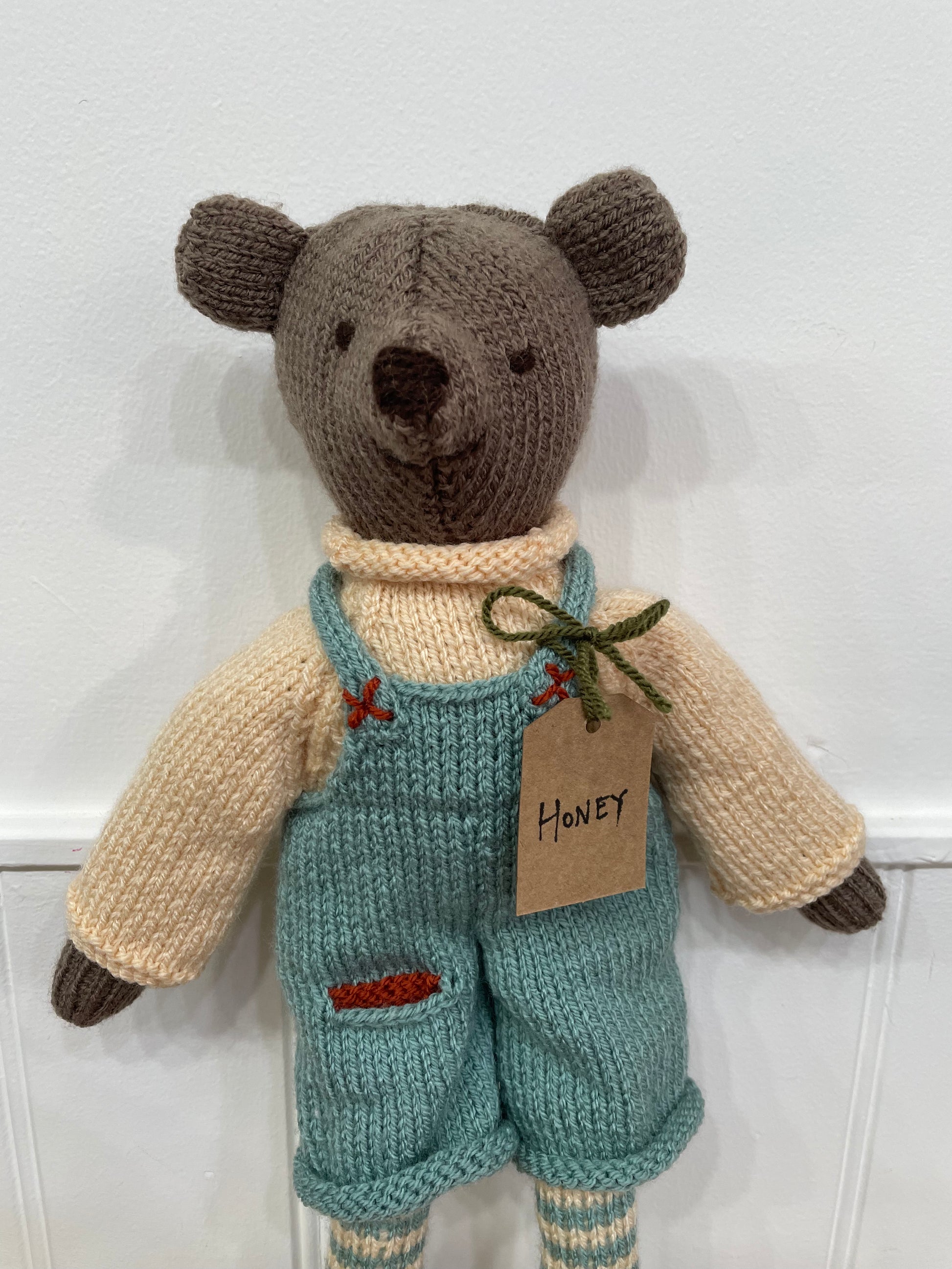 Close up of our hand knitted bear called honey 
A lovely gift for new babies