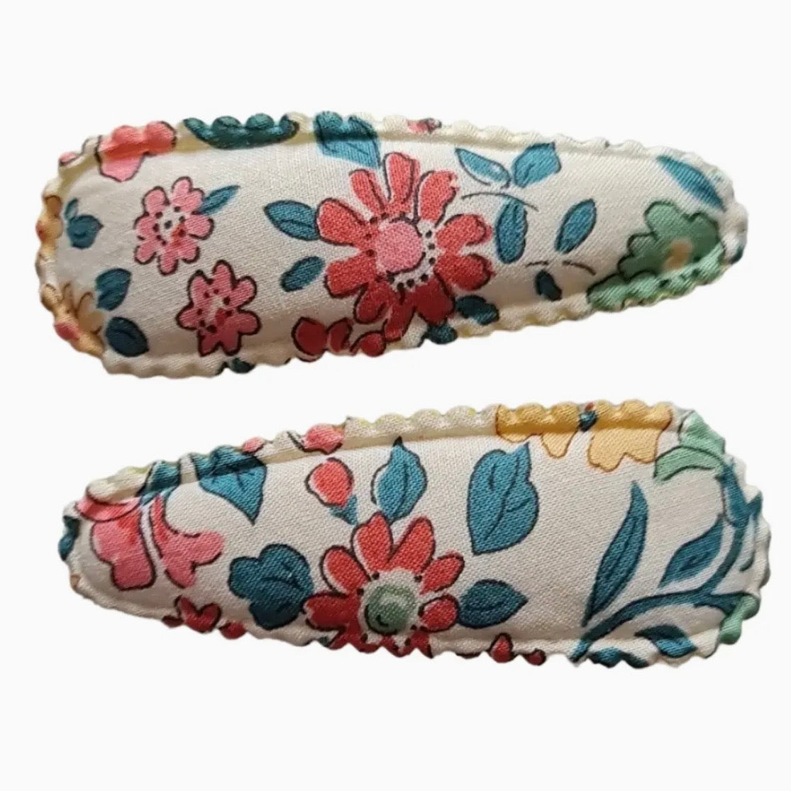 Two fabric-covered hair claw clips with a colourful floral pattern on a white background, shown against a light gray studio backdrop.

Hair Clips
Liberty Print
Gift inspiration 
Floral