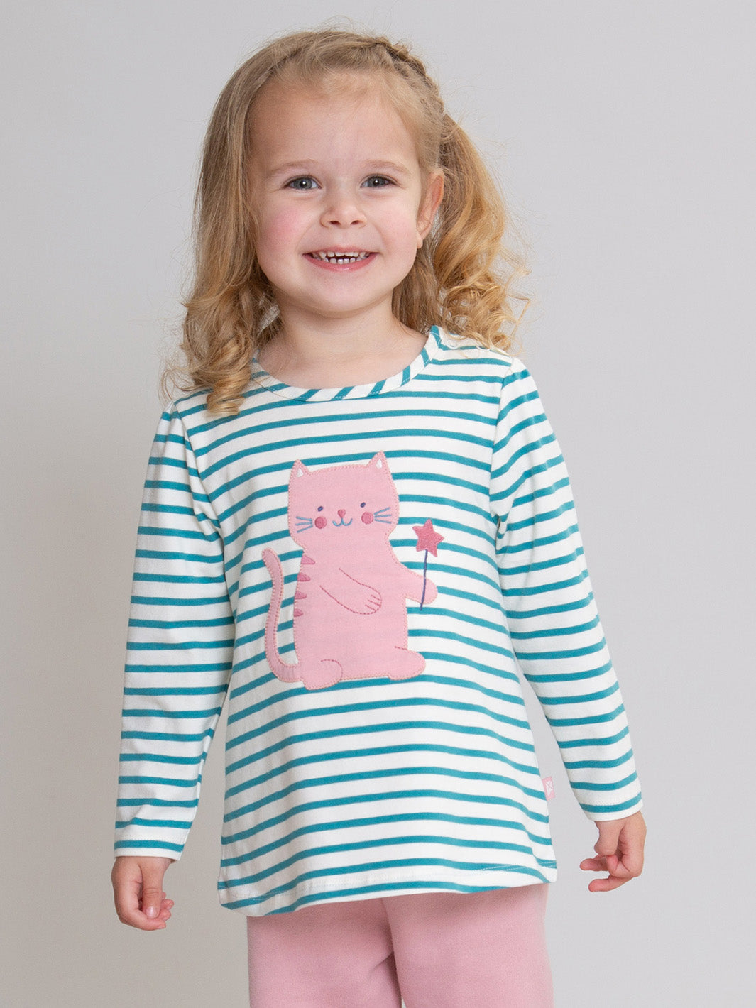 A young girl with blonde hair wearing a long-sleeve shirt with teal and white horizontal stripes and a pink cat appliqué, paired with pink pants, against a solid light grey background.

Chidren's clothing 
Cat
Tunic
T-Shirt
Girls clothing
Kite clothing
Organic cotton 