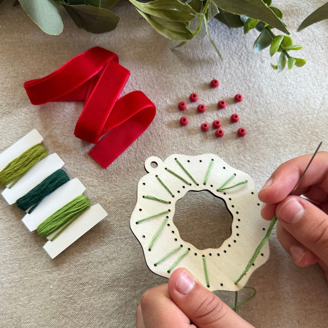 Child making our Make Your Own Christmas Wreath
Plastic free