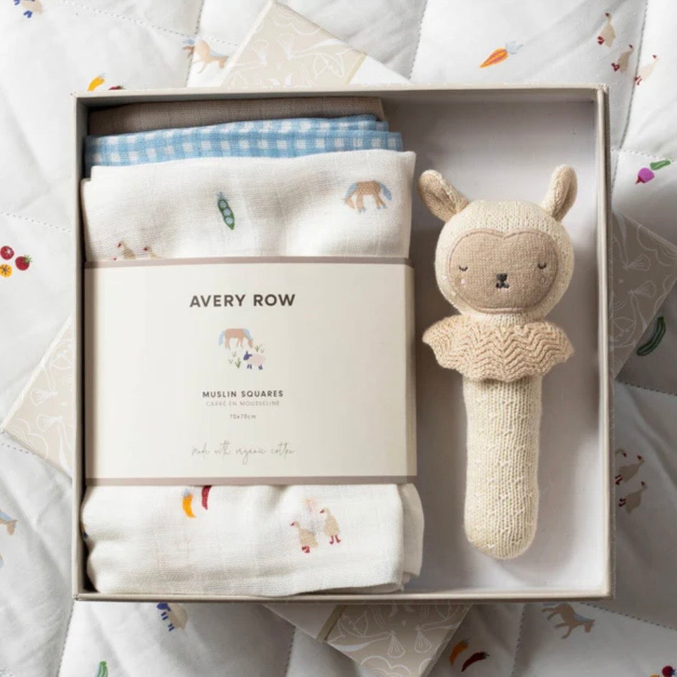 Baby gift set with muslin squares and rattle toy in a box, branded 'Avery Row'.
