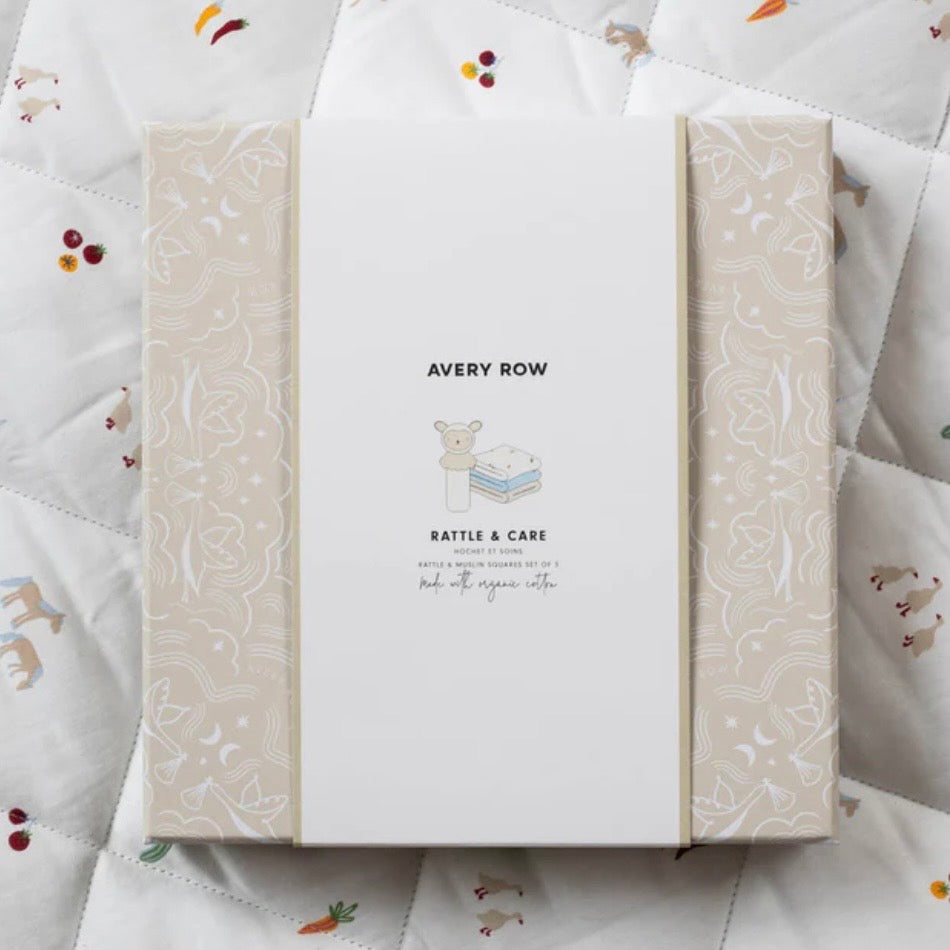 Avery Row rattle and care product packaging on a textured fabric background
New baby gift inspiration 