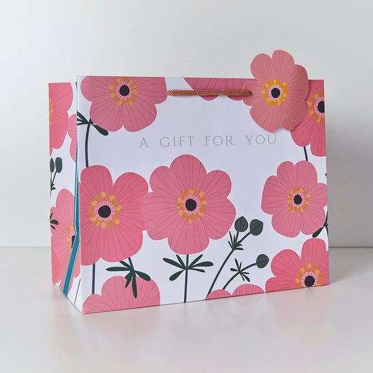 Large gift bag with a pink cosmos print