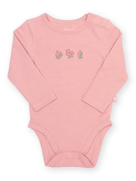 A pink long-sleeve baby bodysuit with three small embroidered flowers on the chest, displayed flat against a white background.

New baby gifts
Baby girl
Organic cotton 
Kite Clothing
Pixie Glade
Bodysuit