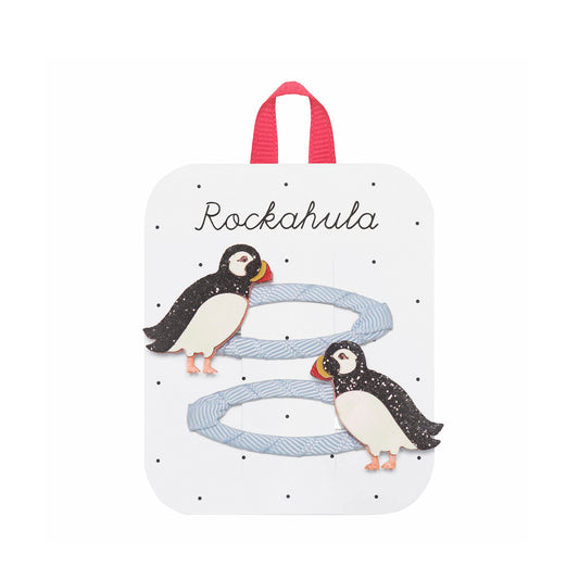 Set of two puffin themed hair clips on a packaged 'Rockahula' card