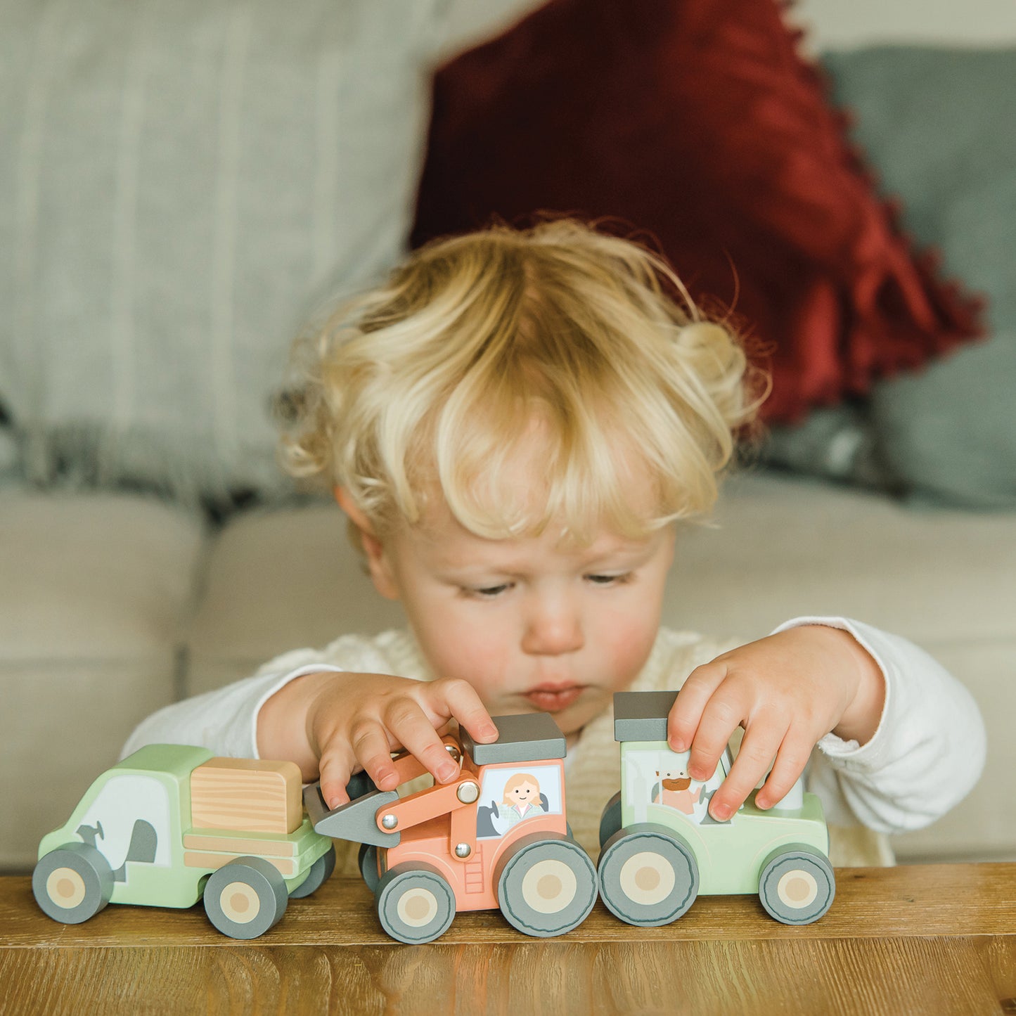 Child playing with our push along vehicles. 
Farmyard themed 