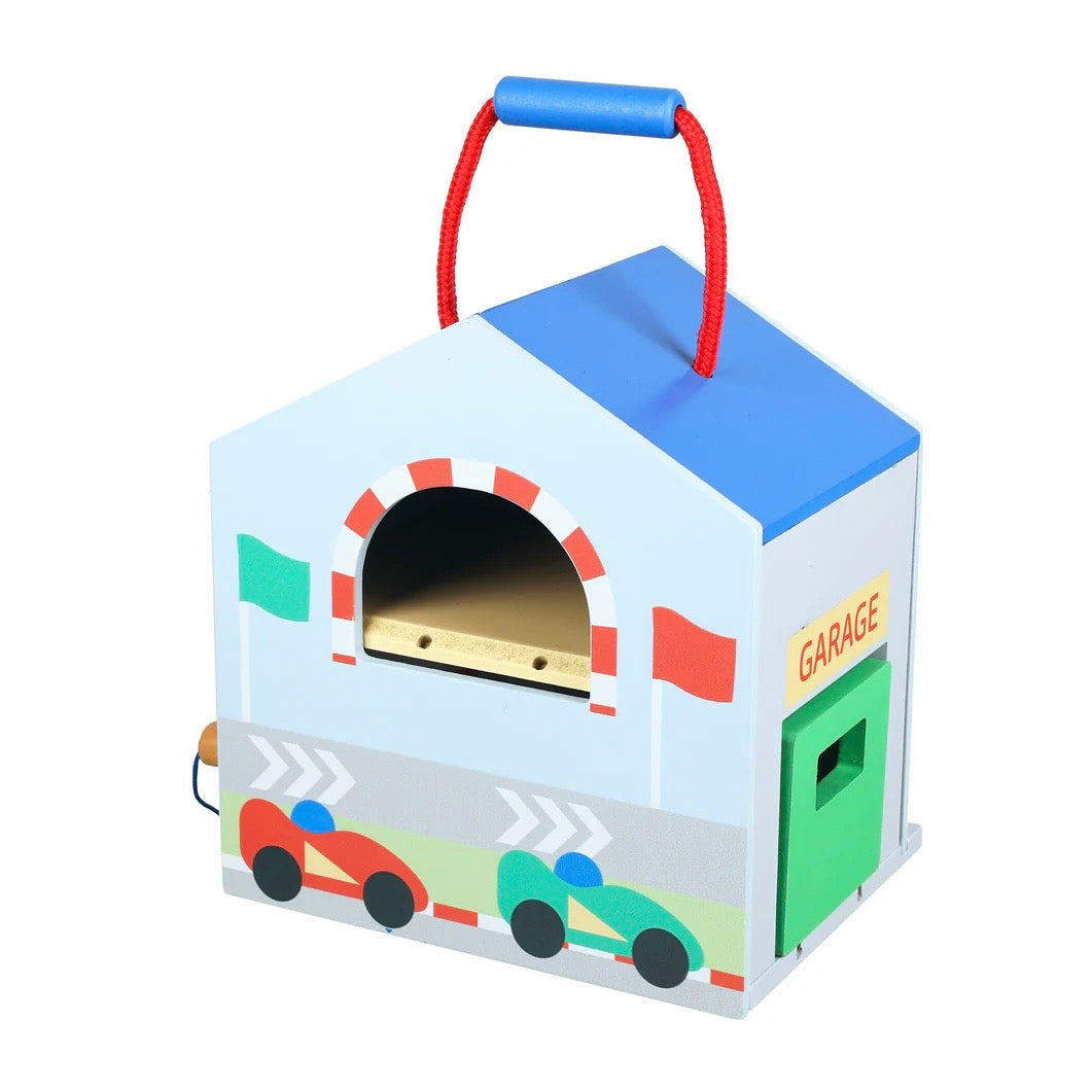 Image shows our Racing Track Play Set from the back, with a wooden garage door and window 