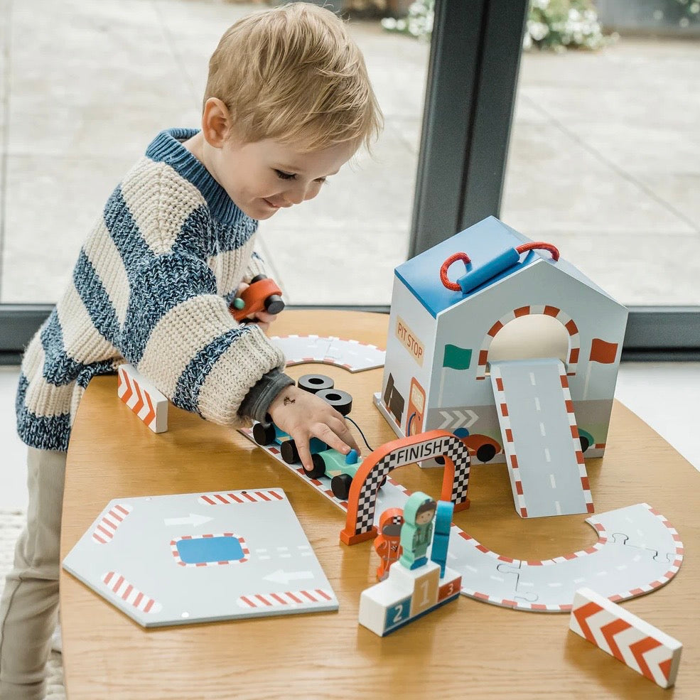 Child playing with our wooden Racing Track Play Set

Plastic free toys