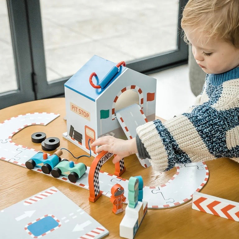 Child playing with our wooden Racing Track Play Set. 

Fantastic for encouraging imaginative play