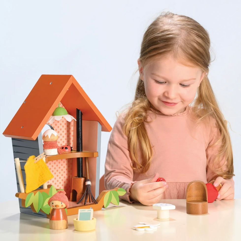 child playing with our Robins Nest Box wooden play set