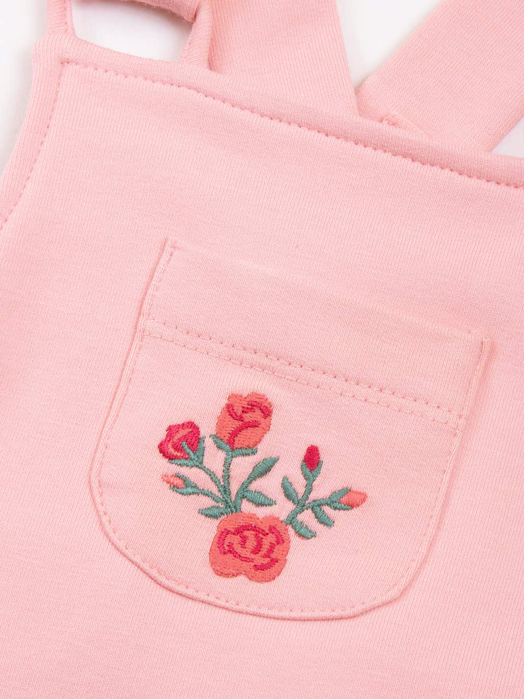 Pink embroidered flowers on front of rose dungarees 