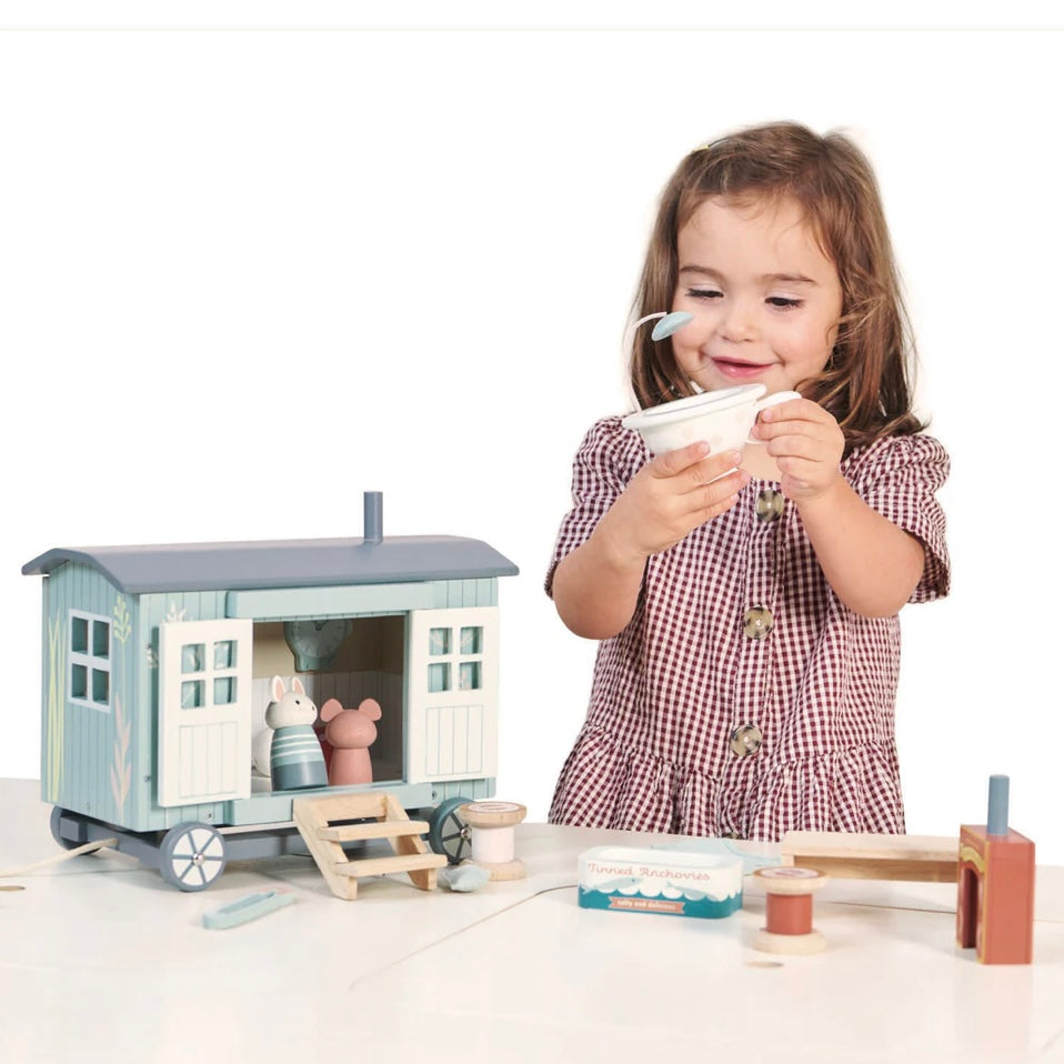 Child playing with our Shepherds Hut, play set which includes mice figures 