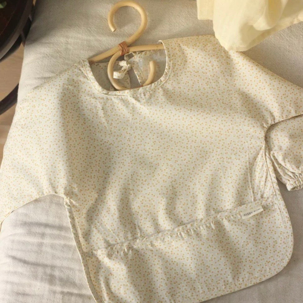 Baby and child sleeved bib in our fabulous Daisy Meadow print
