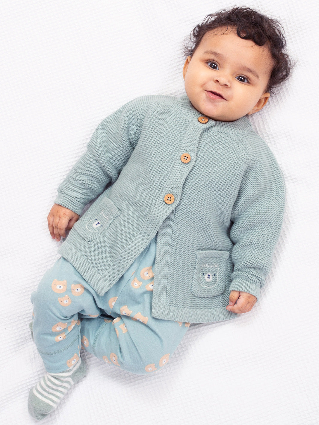 Baby wearing our Three Bears Cardi 
Made form organic cotton