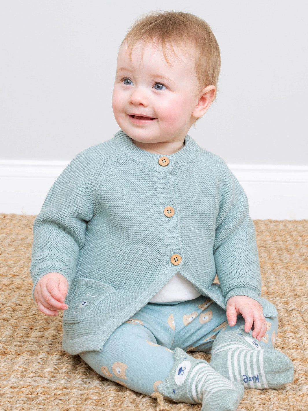Baby wearing our Three Bears Cardi 
With coconut buttons 