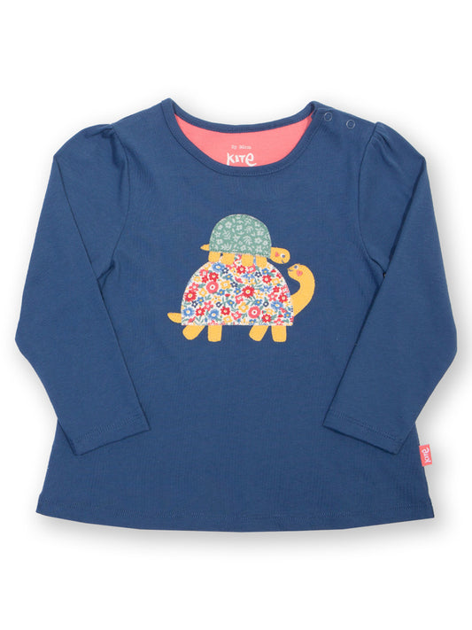 Blue long-sleeve shirt with a floral turtle design on a white background