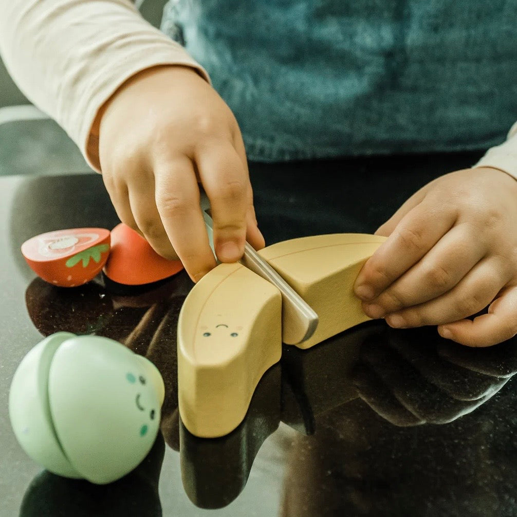 Child cutting our wooden fruit to go in the smoothie maker
Plastic free toys