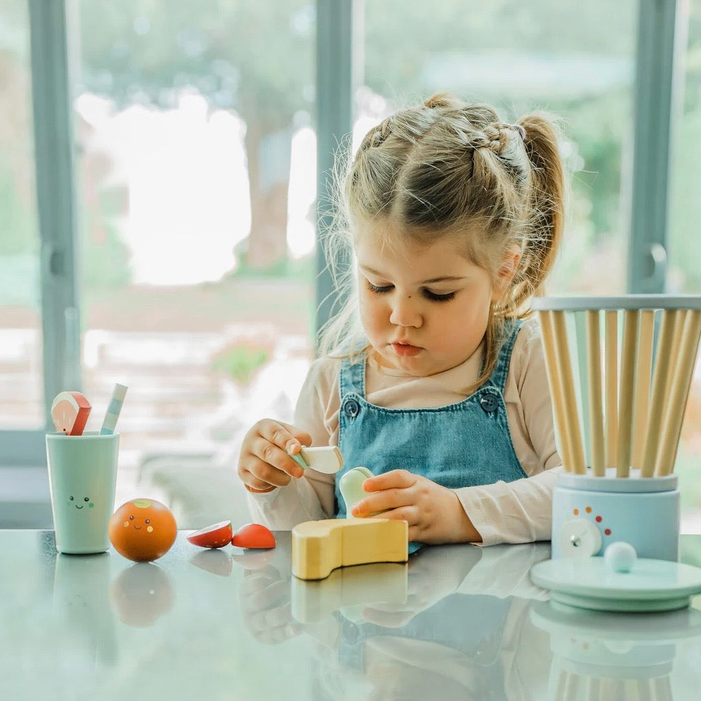 Child playing with our Wooden Smoothie Maker